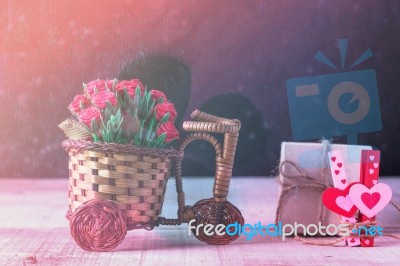 Roses And Gifts On Wooden Stock Photo