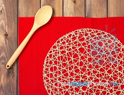 Round Rope Napkin Or Stand, Red Place Mat  And Spoon On A Wooden… Stock Photo