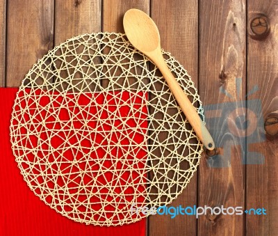 Round Rope Napkin Or Stand, Red Place Mat  And Spoon On A Wooden… Stock Photo