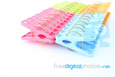 Row Of Peg Package Focus Near On White Background Stock Photo