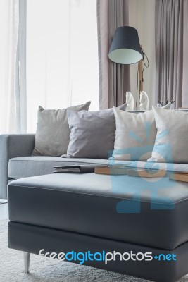 Row Of Pillows On Modern Grey Sofa Stock Photo