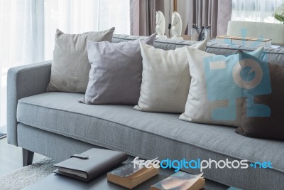 Row Of Pillows On Modern Grey Sofa Stock Photo