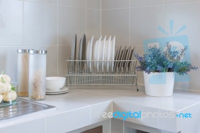 Row Of Plate On Counter In Kitchen Room Stock Photo