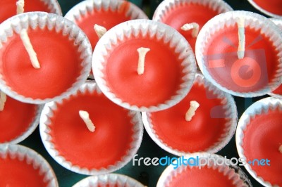 Row Of Red Candles In Small Trays Stock Photo