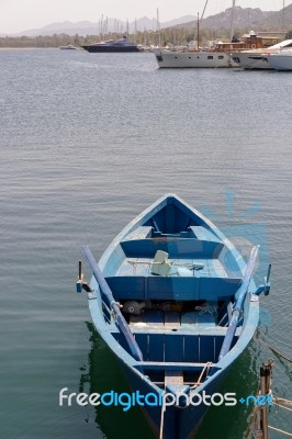 Rowing Boat In The Marina At Cannigione Stock Photo