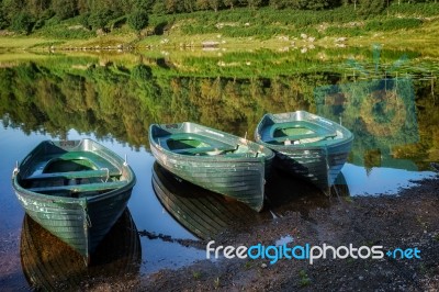 Rowing Boats Moored At Watendlath Tarn In The Lake District Cumb… Stock Photo