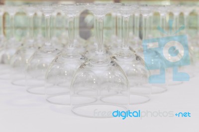 Rows Of Empty Wine Glass Bottoms On White Table Stock Photo