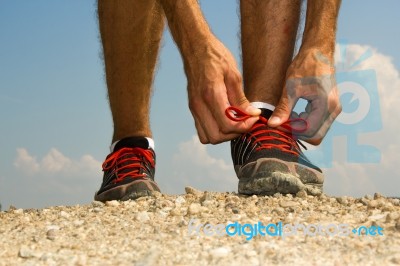 Runner Tying Shoelaces Stock Photo