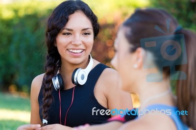 Running Girls Having Fun In The Park Stock Photo