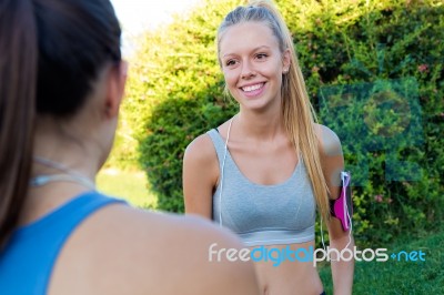 Running Girls Having Fun In The Park Stock Photo