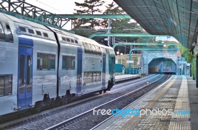 Running Train At Station Stock Photo