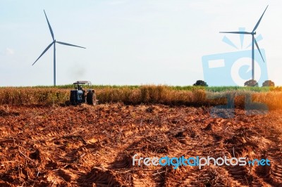 Rural Field With Tractors Were Plowing Stock Photo