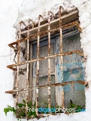 Rusting Bars Across A Window Of A Derelict Building In Casares S… Stock Photo