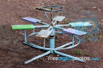 Rusty Merry Go Round On Floor Ground Stock Photo