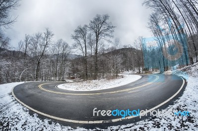 S Curve Road In The Mountains After Winter Snow Storm Stock Photo