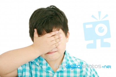 Sad Little Boy Covers His Face Stock Photo