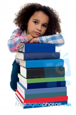 Sad Little Girl Bored Of Reading Stock Photo