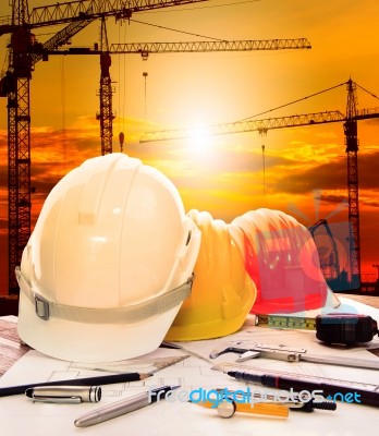 Safety Helmet On Engineer Working Table Stock Photo