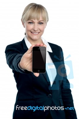 Sales Executive Displaying Brand New Multimedia Phone Stock Photo