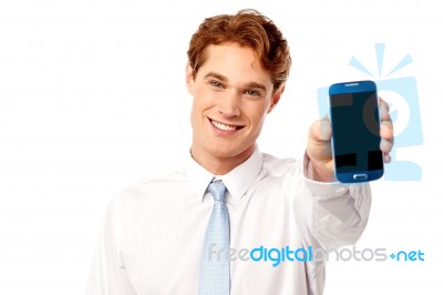 Salesman Displaying Newly Launched Mobile Stock Photo