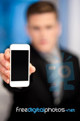 Salesman Displaying Newly Launched Mobile Stock Photo