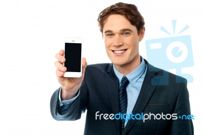 Salesman Displaying Newly Launched Mobile Stock Photo