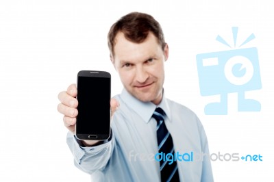 Salesman Displaying Newly Launched Mobile Stock Photo