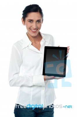 Saleswoman Displaying New Touch Pad Device Stock Photo