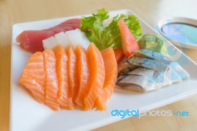 Salmon And Other Fish Raw With Wasabi And Sauce On Table Wood In… Stock Photo