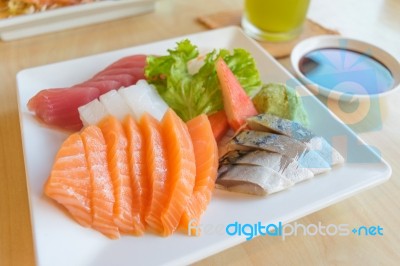 Salmon And Other Fish Raw With Wasabi And Sauce On Table Wood In… Stock Photo