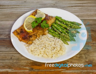 Salmon Dinner On A Rustic Background Stock Photo