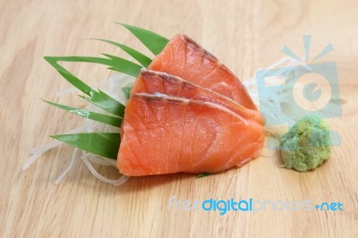 Salmon Sashimi In Wood Background Stock Photo