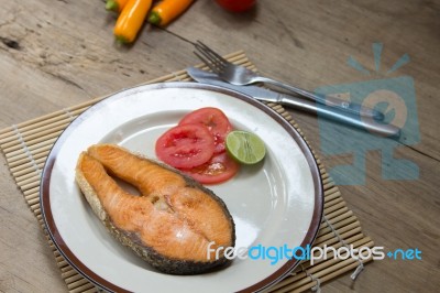 Salmon Steak On Wooden Table Stock Photo