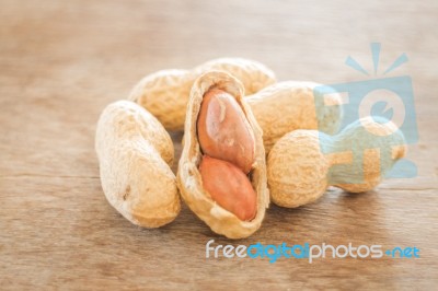 Salted Peanuts On Weathered Wood Stock Photo