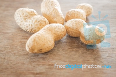 Salted Peanuts On Weathered Wood Stock Photo