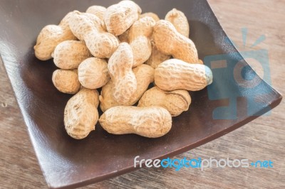 Salted Peanuts On Wooden Bowl Stock Photo