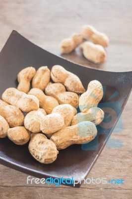 Salted Peanuts On Wooden Bowl Stock Photo