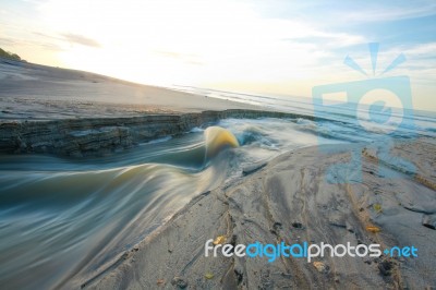 Sand Beach And Lake In The Sunrise Stock Photo