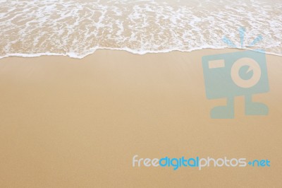 Sand Beach And Wave Stock Photo