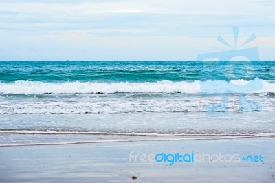 Sand Beach With Blue Ocean Stock Photo