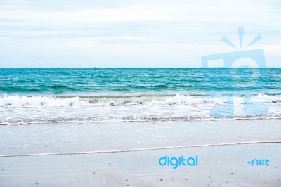 Sand Beach With Blue Ocean Stock Photo