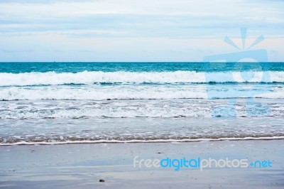 Sand Beach With Blue Ocean Stock Photo