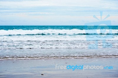 Sand Beach With Blue Ocean Stock Photo