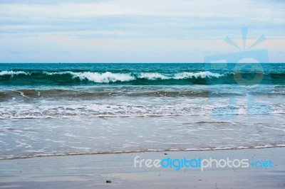 Sand Beach With Blue Ocean Stock Photo