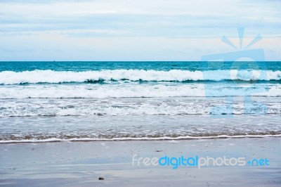 Sand Beach With Blue Ocean Stock Photo