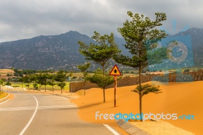 Sand On An Empty Road Stock Photo