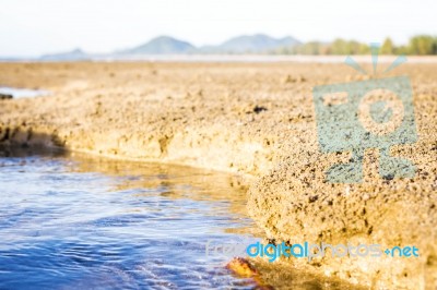 Sandy Beach With Blur Sea On Background Stock Photo