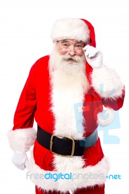 Santa Claus Adjusting His Spectacles Stock Photo