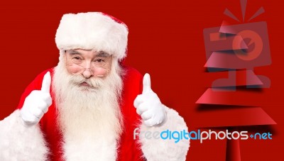 Santa Claus Giving Thumbs Up Gesture Stock Photo