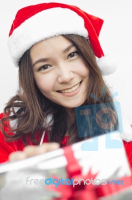 Santa Claus Hat With Grey Christmas Gift Box Stock Photo